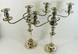 A large pair of silver plate on copper twin branch, three light candleabra,