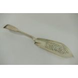 A Victorian silver fiddle pattern fish slice, London 1838, with pierced and reeded decoration, 30.