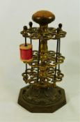 A Victorian gilt metal cotton reel stand, with pin cushion top,