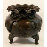 A Japanese bronzed koro, cast in the form of a bag tied up with a cord, with one foot lacking,
