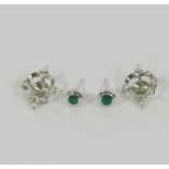 A pair of 18 carat white gold emerald and seed pearl earrings by Cassandra Goad,