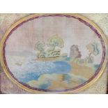 A 19th century embroidered oval silk work panel of a ruin by a lake with a sailing boat,