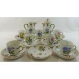 A Herend porcelain part coffee service, comprised of seven cups, eight saucers,