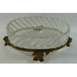 A oval Baccarat ormolu mounted glass dish, raised on four floral cast feet,