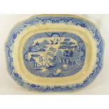 A large 19th century blue and white willow pattern meat platter by John Carr and Co.