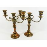 A pair of 'Falstaff' silver plate on copper twin branch three light candleabra, with beaded detail,