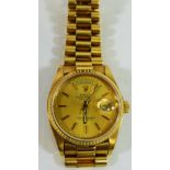 A 1980's 18 carat gold Rolex Oyster perpetual day date wrist watch,