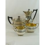 A George VI silver four piece tea set, Sheffield 1938, with gadrooned rim and raised on ball feet,