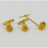 A pair of yellow metal gold nugget cuff links stamped '14K', combined weight 8.