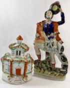 A 19th century Staffordshire flatback figure of a Scottish huntsman with deer over his shoulder,