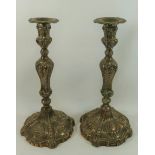 A pair of large George III silver candlesticks, London 1769, with indistinct maker's mark,