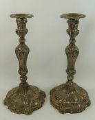 A pair of large George III silver candlesticks, London 1769, with indistinct maker's mark,