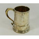 A George VI silver tankard, with straight sides, scroll handle and stepped foot,