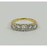 A yellow metal diamond five stone carved half hoop ring,