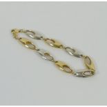 A 9 carat gold, bi-colour bracelet, with hollow links,