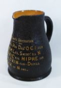 A Royal Doulton tavern jug in the form of a leather jack,