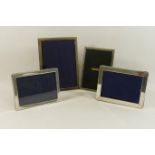 Four rectangular silver photograph frames, of plain design, two for photographs 12.
