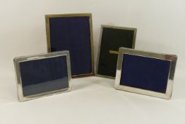 Four rectangular silver photograph frames, of plain design, two for photographs 12.