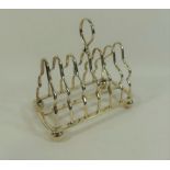 A George V silver seven bar toast rack, Sheffield 1910 by Martin Hall and Co.