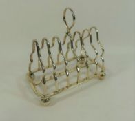 A George V silver seven bar toast rack, Sheffield 1910 by Martin Hall and Co.