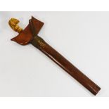 An antique Indonesian ivory handled kris, with wooden scabbard, handle at fault,
