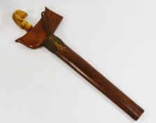 An antique Indonesian ivory handled kris, with wooden scabbard, handle at fault,