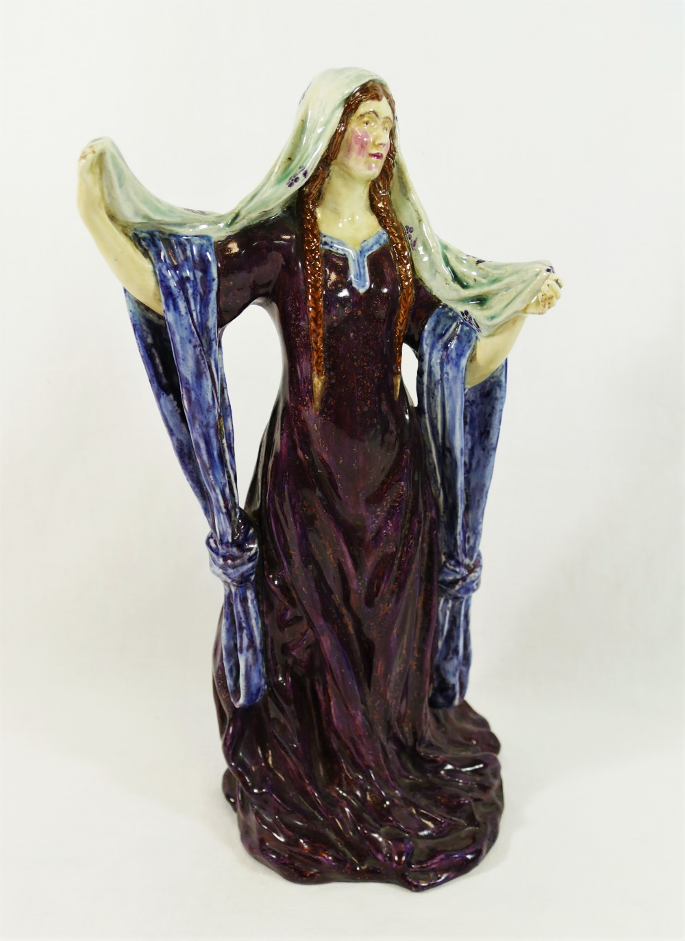 An early 20th century pottery figure of Ellen Terry playing Lady Macbeth,