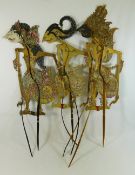 Five Indonesian Wayang Kulit painted leather shadow puppets, with horn supports,