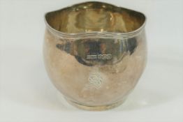 A small George V circular silver sugar bowl, with wavy reeded rim, 6.2cm high, 2.71ozt, 84.