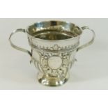 A George I silver porringer, with reeded scroll handles and half reeded and fluted body,