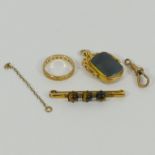 A 9 carat gold and bloodstone spinning fob, Chester 1910, a 9 carat gold tiger's eye bar brooch, 4.