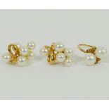 A pair of Mikimoto cultured pearl yellow metal screw back earrings, stamped '14K',