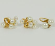 A pair of Mikimoto cultured pearl yellow metal screw back earrings, stamped '14K',