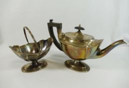 An Edwardian silver pedestal teapot and sugar bowl, the teapot with ebonised handle and knop,