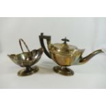 An Edwardian silver pedestal teapot and sugar bowl, the teapot with ebonised handle and knop,