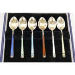 A set of silver gilt and enamel coffee spoons, London 1968, by Garrard and Co,