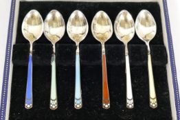 A set of silver gilt and enamel coffee spoons, London 1968, by Garrard and Co,