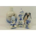 Five items of Royal Copenhagen, comprised of a penguin group, 9.5cm high, a small vase, 14.