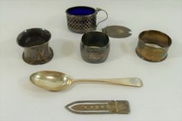 A small quantity of silver, comprised of three napkin rings, an oval mustard pot,