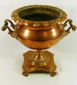 A 19th century two handled copper urn, converted from a samovar, raised on square base,