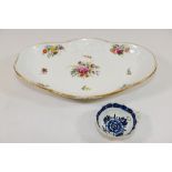 An 18th century Derby soft paste porcelain blue and white wine taster with leaf handle and