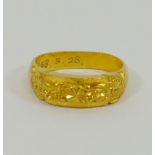 A yellow metal ring, stamped '99' with inscription 'T.T.C. KOREA 1968.5.28', 11.