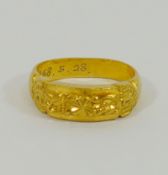A yellow metal ring, stamped '99' with inscription 'T.T.C. KOREA 1968.5.28', 11.