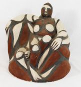 Signe Kolding (20th/21st century Danish)+ Stoneware sculpture of a seated woman, decorated in red,