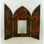 A wooden penwork triptych picture frame, decorated with poppies within hand punched surround,