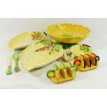 A quantity of Carlton Ware comprised of two toast racks, a butter knife and conserve spoon,