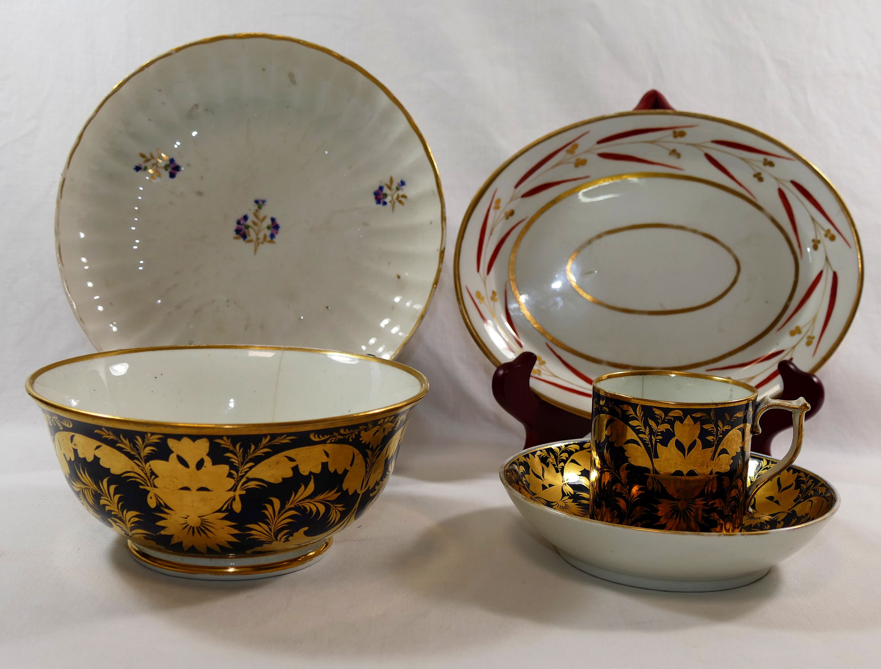 Five pieces of 18th century and later Derby porcelain comprised of a matching coffee can,