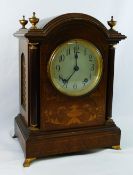 An early 20th century dome topped rosewood cased inlaid mantle clock,