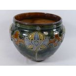 A Royal Doulton pottery jardinere, with scroll and stylised floral tube lined decoration,