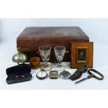 Assorted miscellaneous items including a corkscrew, Georgian glasses, a silver plated bell, coins,